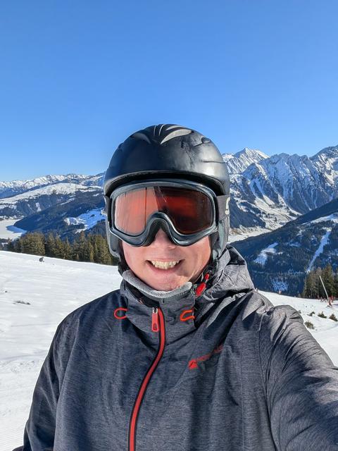 Selfie in front of a snow-covered mountain
