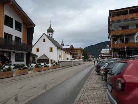 Looking down the main street in Gerlos, a church is visible