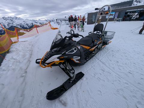 A snow scooter in the snow