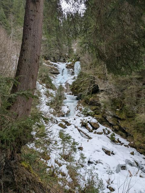 A frozen waterfall with some water still visible