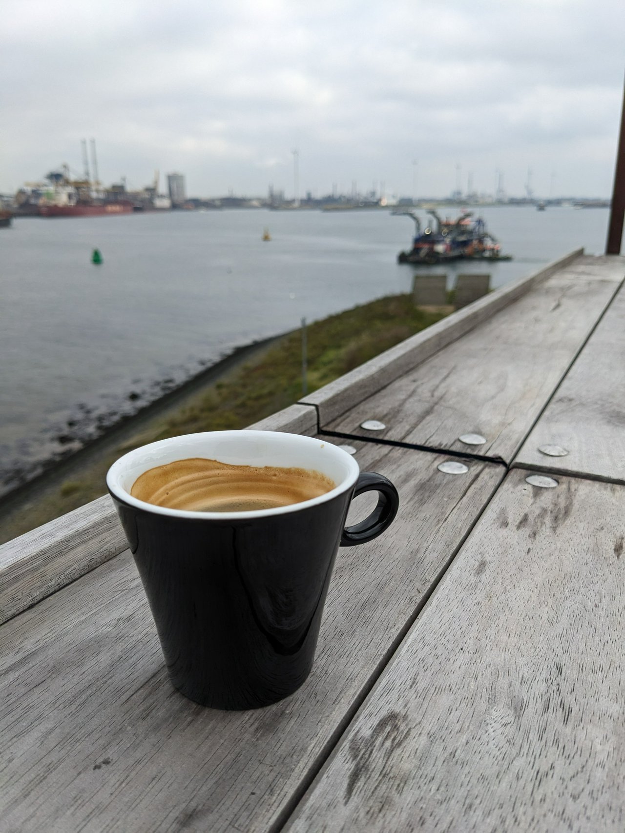 Coffee at Forteiland IJmuiden. Overlooking the heavy industry at the IJmuiden harbour, close to Amsterdam.