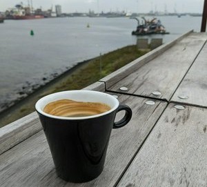 Coffee at Forteiland IJmuiden. Overlooking the heavy industry at the IJmuiden harbour, close to Amsterdam.