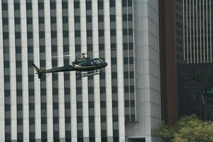 Helicopter about to land on an helipad in the East River