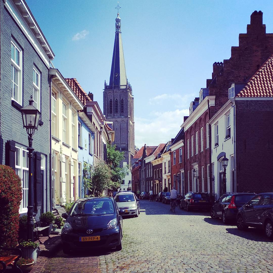 Old street in the fortified town of Doesburg with the Martinichurch in the background